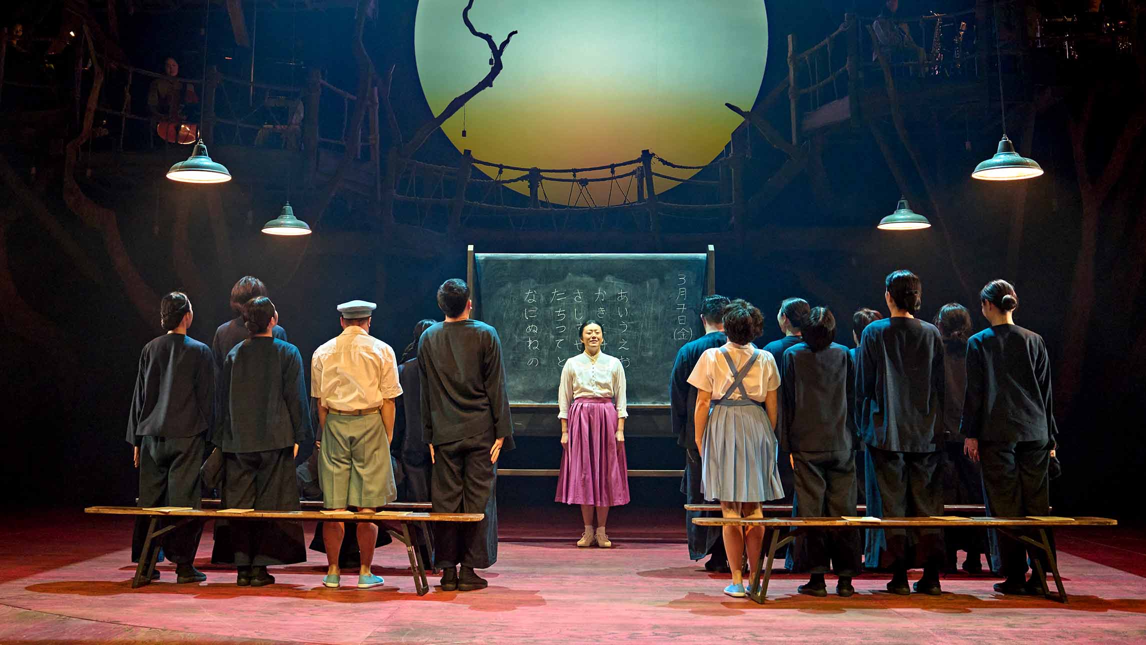 A group of actors in My Neighbour Totoro theatre production at the Gillian Lynne Theatre, London
