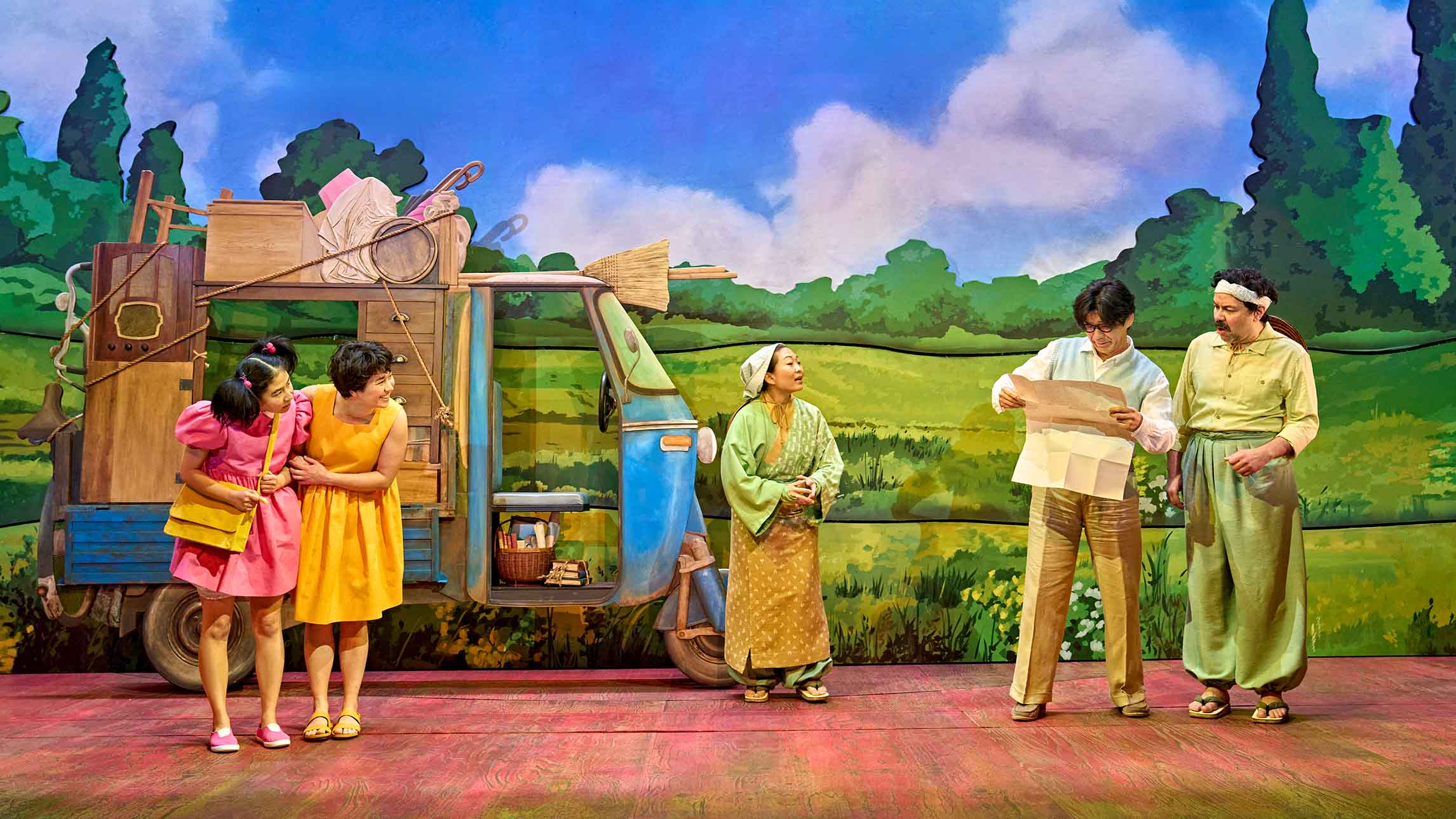 5 actors in a scene from My Neighbour Totoro theatre production at the Gillian Lynne Theatre, London