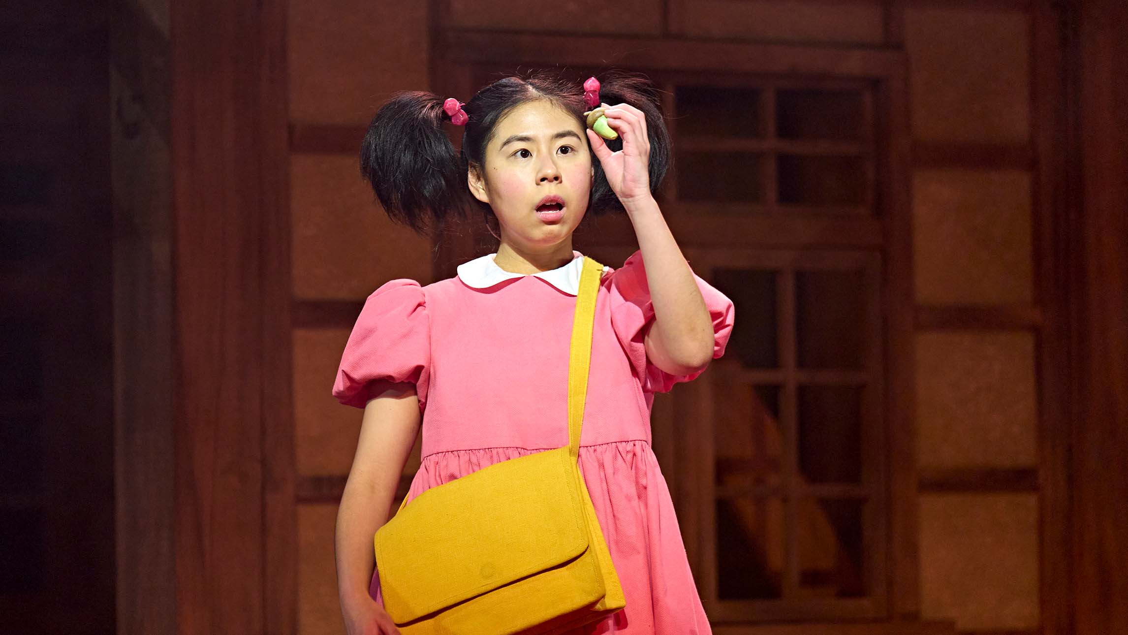 A close up on an actor from My Neighbour Totoro theatre production at the Gillian Lynne Theatre, London