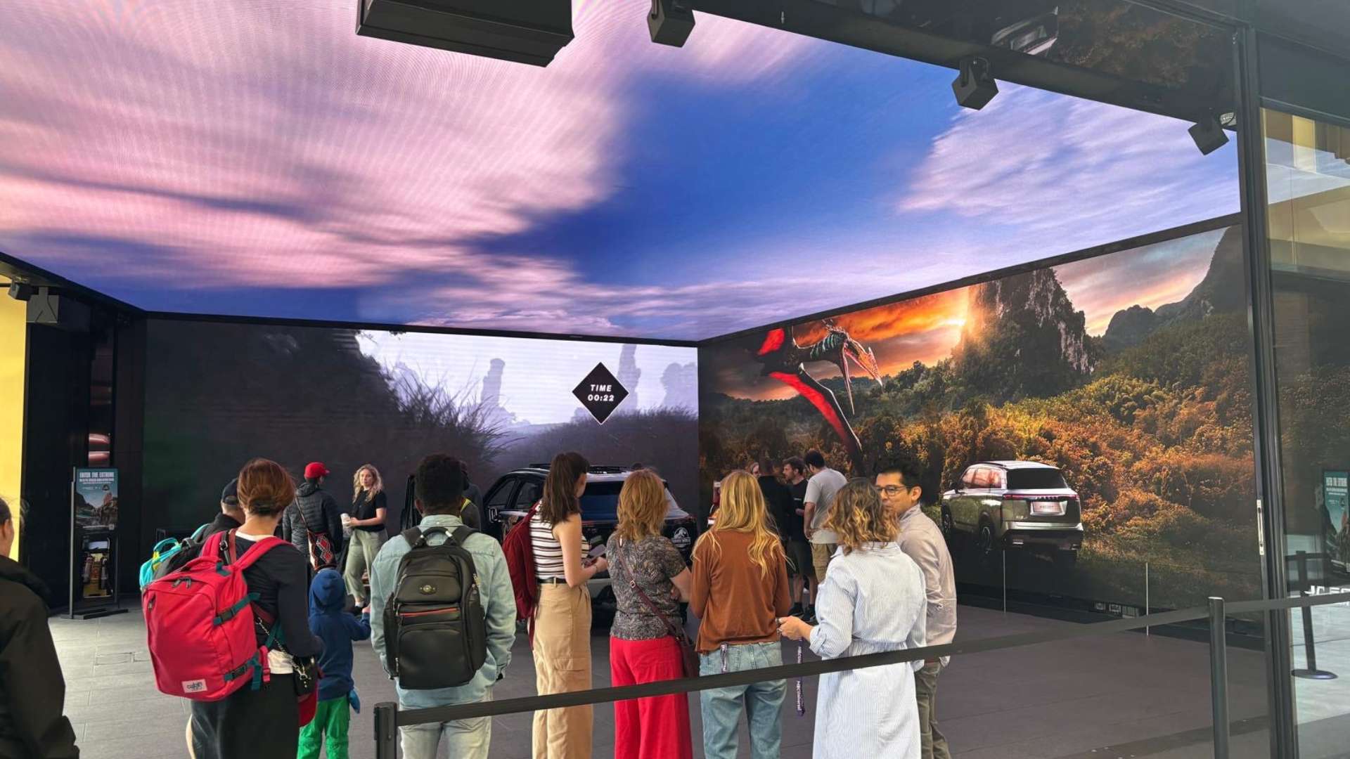 Visitors enjoying Outernet's Jaecoo car installation