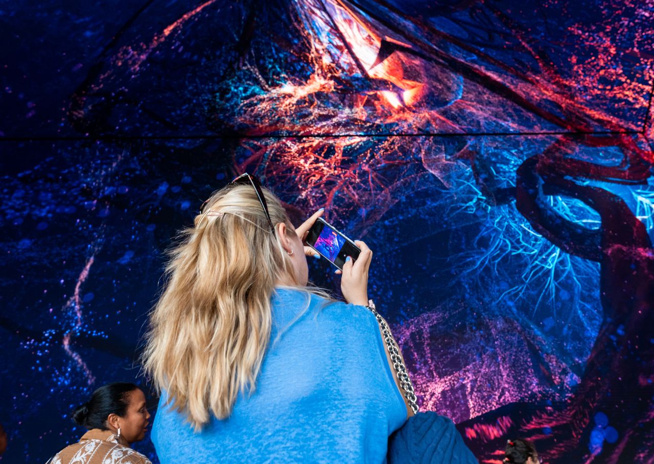 Woman taking picture of Biophilia