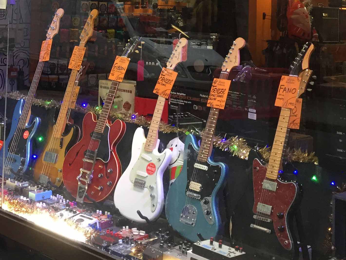 Guitars in a shop window on Denmark Street